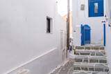 Fototapeta Na drzwi - Cyclades, Greece. Ios, Nios island, Chora. Whitewashed buildings and narrow cobblestone alley.