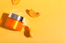 Jar Of Natural Mask And Pumpkin Slices On Color Background