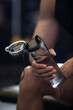 © Blue Jean Images - Young man drinking water after exercising at gym