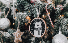 Close-up Photo Of Wooden Christmas Ornament With Polar Bear Wearing A Scarf