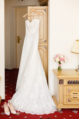 Wall Mural - Wedding dress in a room. Bride's morning preparation