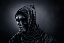 Grim Reaper Over Dark Misty Background