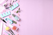 © Atlas - Concept of nail care with manicure accessories on pink background