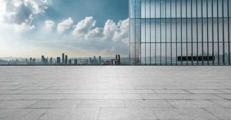 Empty floor with modern city skyline and buildings