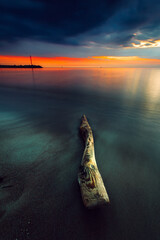 Canvas Print - Vertical shot of the colorful sunset at the coast of the Baltic Sea, Lithuania