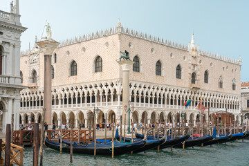 Wall Mural - Doge's Palace in Venice from Grand Canal with gondolas and wooden piers