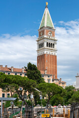 Wall Mural - St Mark’s Campanile tall bell tower in Venice with pine trees in foreground