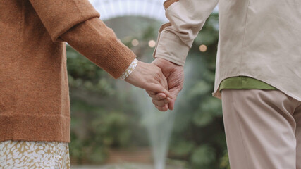 Wall Mural - Couple Holding Hands - Concept For Love, Romance And Togetherness