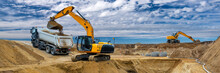 Digger And Excavator At Work In Construction Site
