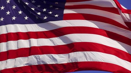 Wall Mural - us flag blowing in the breeze. shot with a high-speed camera