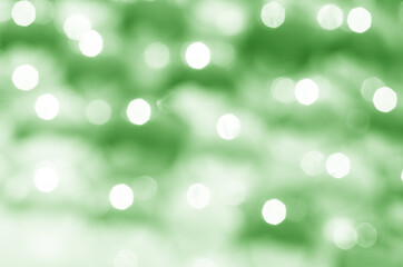 Wall Mural - defocused lights on green background