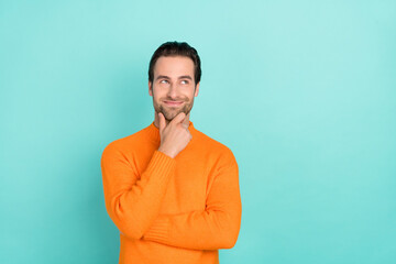 Poster - Photo of young man good mood hand touch chin curious look empty space isolated over teal color background