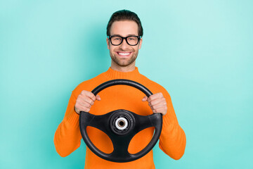 Poster - Photo of young cheerful man ride auto transport vacation journey isolated over turquoise color background