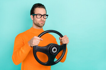 Poster - Profile side photo of young guy drive automobile vehicle serious speed isolated over turquoise color background