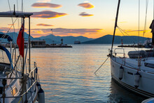 Boats Along The Marina Of The Greek Fishing Village Of Aegina Greece At Sunset.