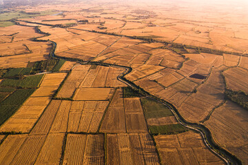 Agricultural barren fields with irrigation canal in farmland at countryside