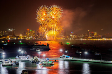 Sticker - colorful fireworks display over the night sky of the city during a festival