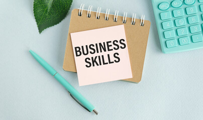 BUSINESS SKILLS text written on notebook on the chart with keyboard and planning