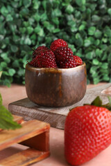 Canvas Print - Wooden bowl filled with ripe raspberries