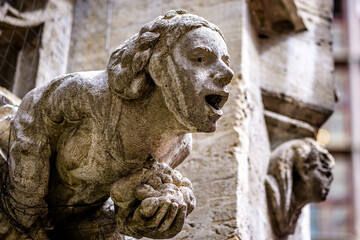 historic sculpture (gargoyle) at the city hall in munich