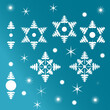 Collection of snowflakes and fir trees. White, separated from blue gradient background. Abstract