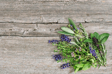 Sticker - Fresh herbs wooden background. Basil rosemary mint sage thyme lavender