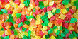 Tutti frutti candied colorful fruits bits background top view.