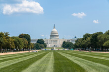 Traditional Neoclassical Architecture Of The Capitol Dome Building And Green Lawn, Washington DC, USA. Home Of Congress And Capitol Hill. The Concept Of Legislative Branch, American Political System.
