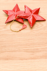 Wall Mural - red wooden star Christmas decoration on a wooden background