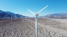 Majestic Wind Turbine Spinning In Desert Area Farm, Aerial Drone Close Up Orbit View