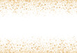 A gold glitter confetti border with copyspace on white
