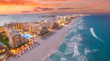 Wall Mural - Cancun beach during with red sunset and blue hour
