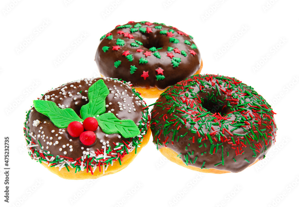 Tasty Christmas donuts on white background