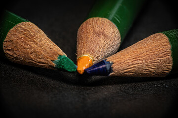 Wall Mural - Closeup shot of three wooden pencils