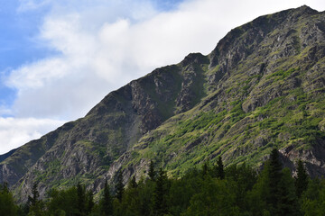 Sticker - View of the slope of the mountain against the sky.