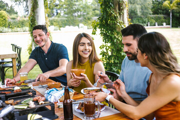 Group of latin friends eating mexican food in the restaurant terrace in Mexico Latin America