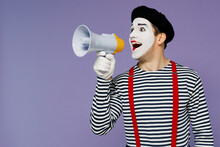 Charismatic Young Mime Man With White Face Mask Wears Striped Shirt Beret Hold Scream In Megaphone Announces Discounts Sale Hurry Up Isolated On Plain Pastel Light Violet Background Studio Portrait.
