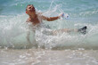 © ruslanshug - kid with diving mask and flippers falling in sea water splash during summer outdoors leisure activity holiday