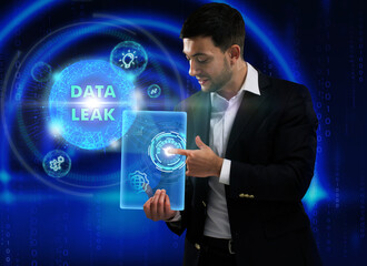 Business, Technology, Internet and network concept. Young businessman working on a virtual screen of the future and sees the inscription: Data leak