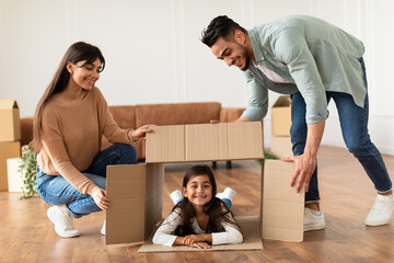 Wall Mural - Happy loving young family celebrating relocation together