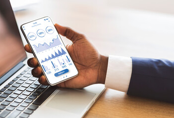 Poster - Black manager using mobile phone with trading app