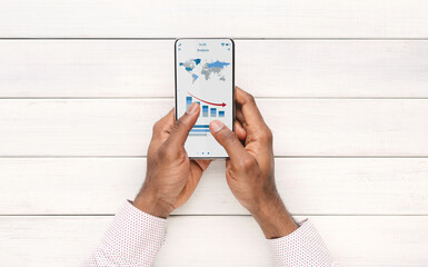 Poster - African american businessman using financial app on smartphone