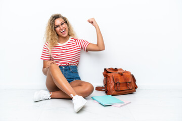 Wall Mural - Young student woman sitting one the floor doing strong gesture