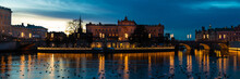Beautiful Panoramic View Of The Norrstrom River And The Illuminated Helgeandsholmen Island With The Parliament House At Twilight, Stockholm, Sweden
