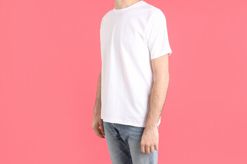 Poster - Man in blank white t-shirt on pink background