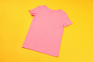 Wall Mural - Blank pink t-shirt with space for print on yellow background