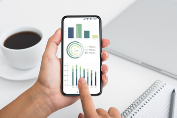 Aufkleber - Business analyst holding mobile phone with trading app