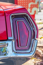 The Red Brake Light Or Taillight Of A Red Classic Car Or Muscle- Car