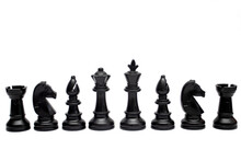 Set Of Black Chess Pieces Are Lined Up Isolated On A White Background