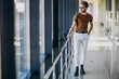 © Petro - Young handsome man standing by the window at the airport